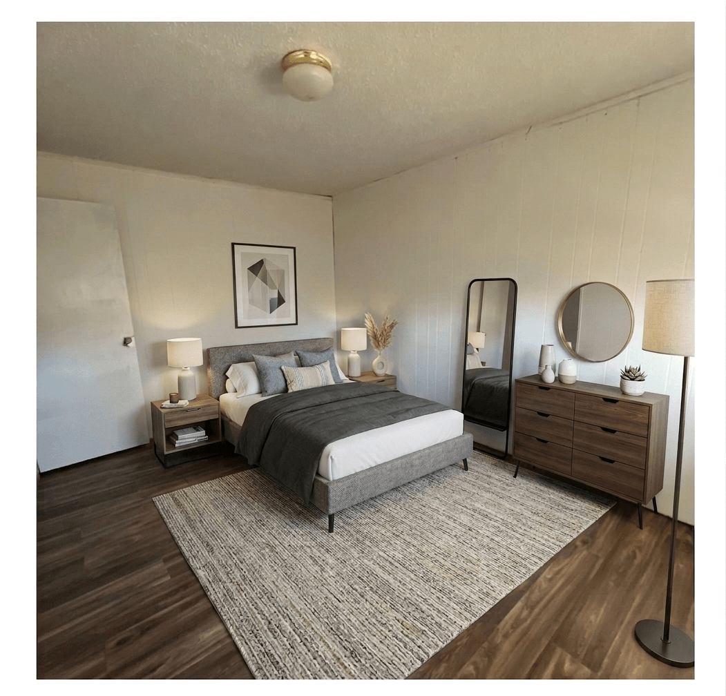 A bedroom with a bed, nightstands, and a dresser.
